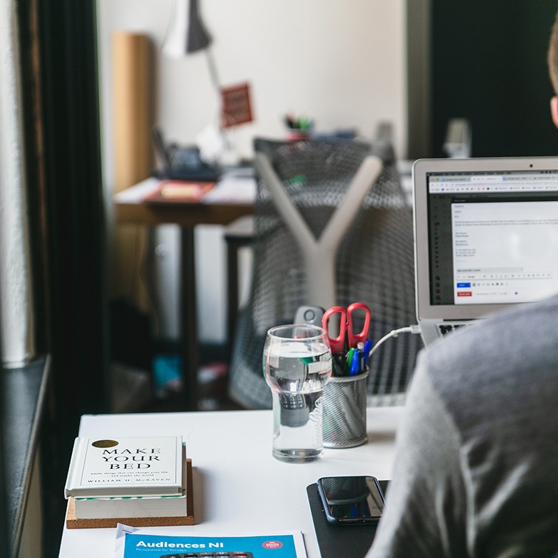 photo of software engineer working at a desk in an office